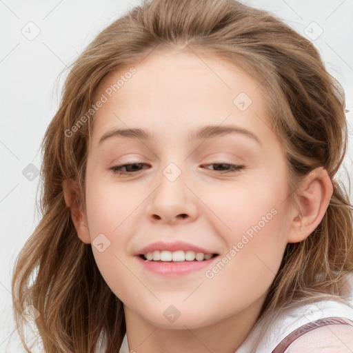 Joyful white child female with long  brown hair and blue eyes