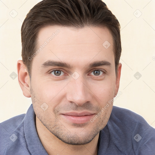 Joyful white young-adult male with short  brown hair and brown eyes