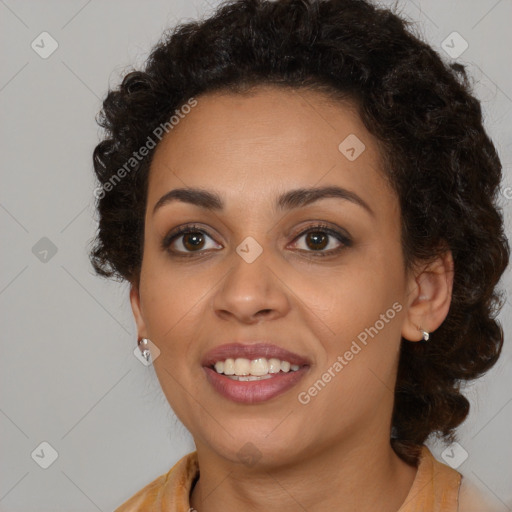 Joyful black young-adult female with medium  brown hair and brown eyes