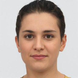 Joyful white young-adult female with short  brown hair and brown eyes