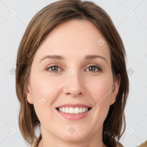 Joyful white young-adult female with medium  brown hair and green eyes