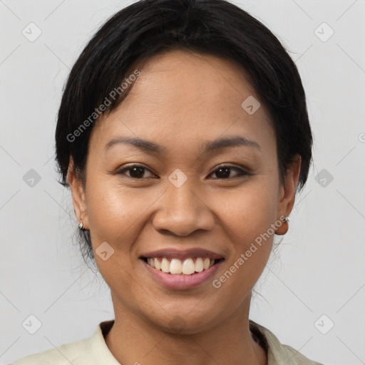 Joyful asian young-adult female with short  brown hair and brown eyes