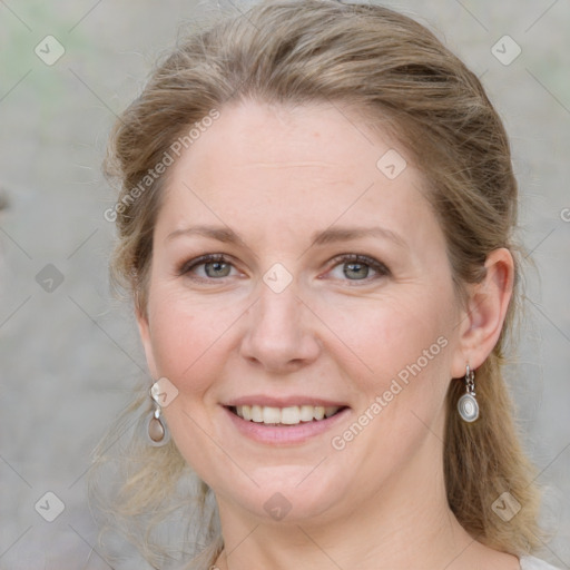 Joyful white adult female with medium  brown hair and blue eyes