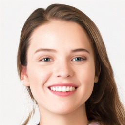 Joyful white young-adult female with long  brown hair and blue eyes