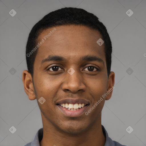 Joyful black young-adult male with short  black hair and brown eyes