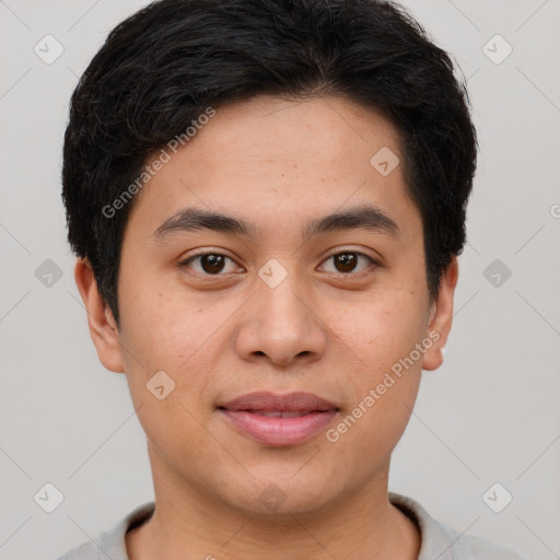 Joyful asian young-adult male with short  brown hair and brown eyes