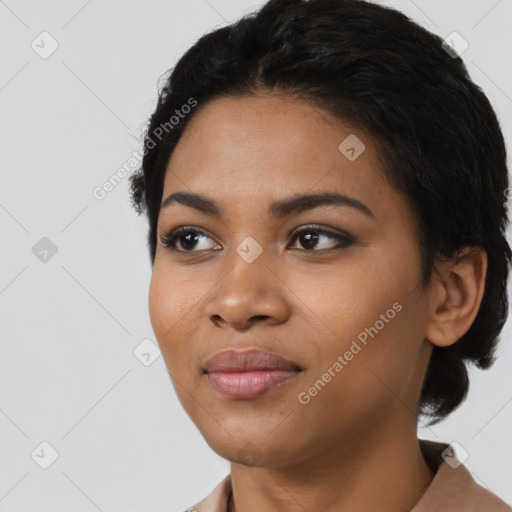 Joyful latino young-adult female with short  black hair and brown eyes