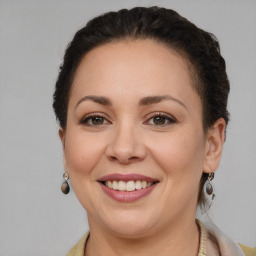 Joyful white adult female with short  brown hair and brown eyes