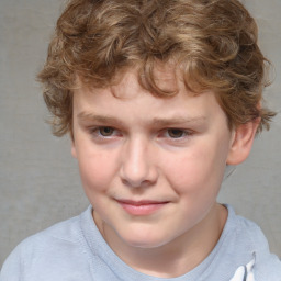 Joyful white child male with short  brown hair and brown eyes