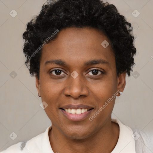 Joyful black young-adult female with short  black hair and brown eyes