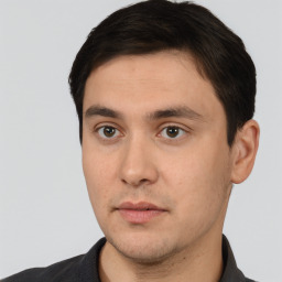 Neutral white young-adult male with short  black hair and brown eyes