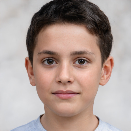 Joyful white child male with short  brown hair and brown eyes