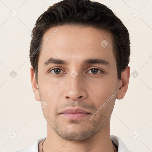 Neutral white young-adult male with short  brown hair and brown eyes