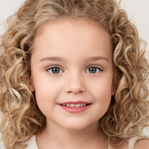 Joyful white child female with medium  brown hair and green eyes