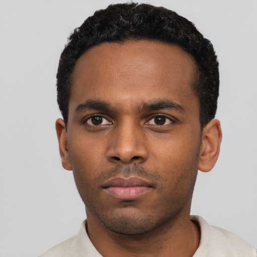 Neutral black young-adult male with short  black hair and brown eyes