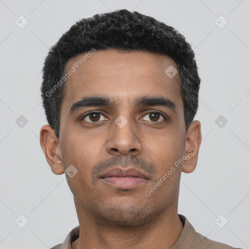 Neutral latino young-adult male with short  black hair and brown eyes