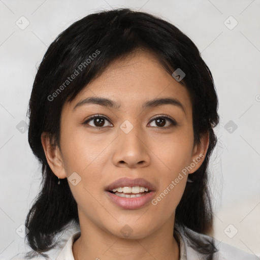 Joyful asian young-adult female with medium  black hair and brown eyes