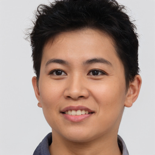 Joyful asian young-adult female with short  brown hair and brown eyes