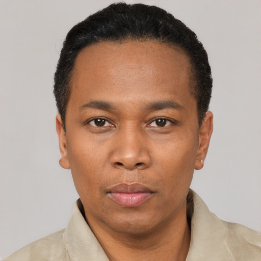 Neutral black adult male with short  black hair and brown eyes