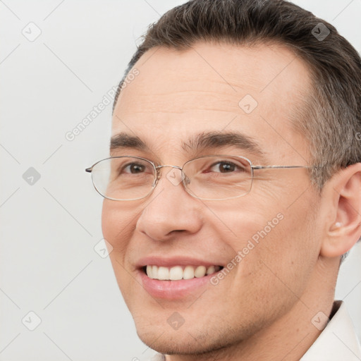 Joyful white adult male with short  brown hair and brown eyes