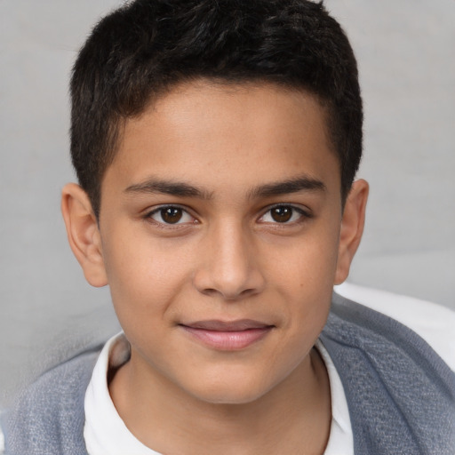 Joyful white child male with short  brown hair and brown eyes