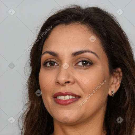 Joyful white adult female with long  brown hair and brown eyes