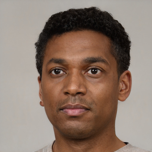 Neutral black young-adult male with short  black hair and brown eyes