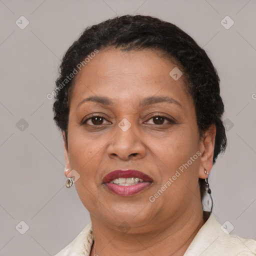 Joyful latino adult female with short  brown hair and brown eyes