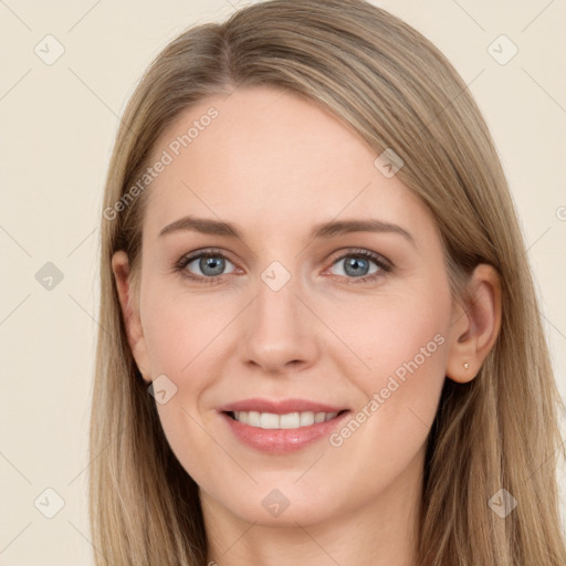 Joyful white young-adult female with long  brown hair and grey eyes