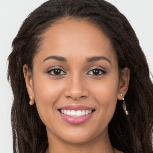 Joyful white young-adult female with long  brown hair and brown eyes