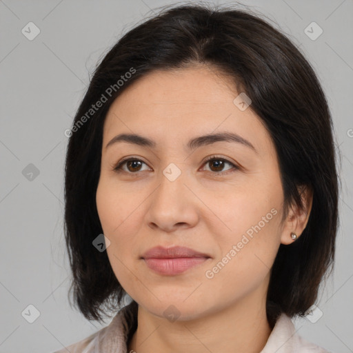 Joyful asian young-adult female with medium  brown hair and brown eyes