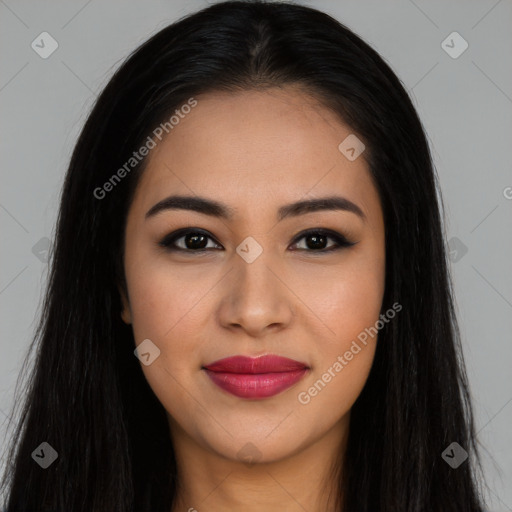 Joyful latino young-adult female with long  brown hair and brown eyes