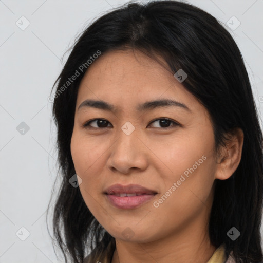 Joyful latino young-adult female with medium  brown hair and brown eyes