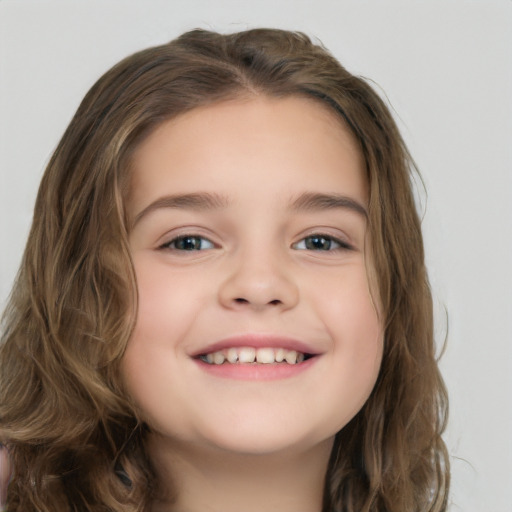 Joyful white child female with long  brown hair and brown eyes