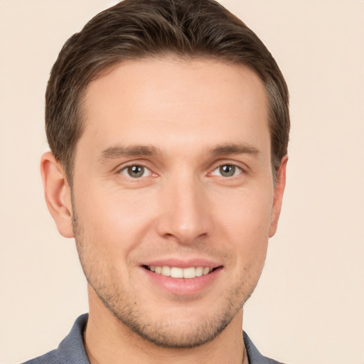 Joyful white young-adult male with short  brown hair and brown eyes