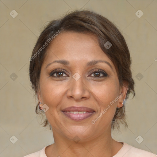 Joyful white adult female with medium  brown hair and brown eyes