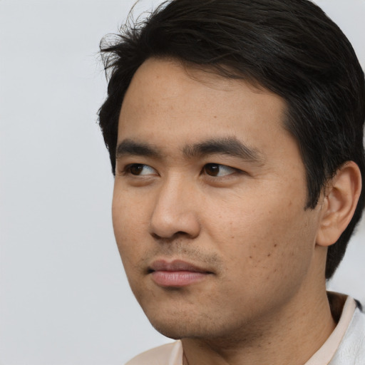 Neutral asian young-adult male with short  black hair and brown eyes