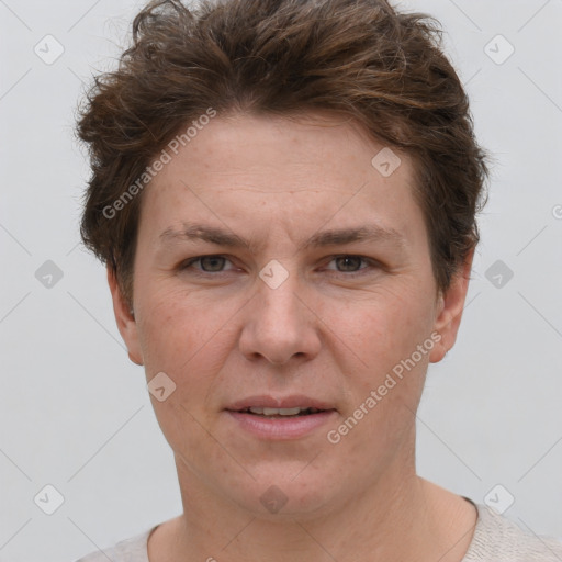 Joyful white adult female with short  brown hair and grey eyes