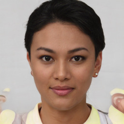 Joyful asian young-adult female with short  black hair and brown eyes