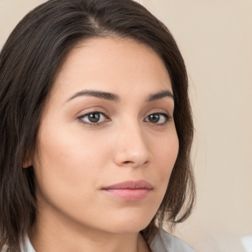 Neutral white young-adult female with medium  brown hair and brown eyes