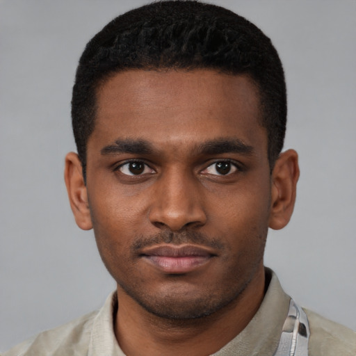 Neutral latino young-adult male with short  brown hair and brown eyes