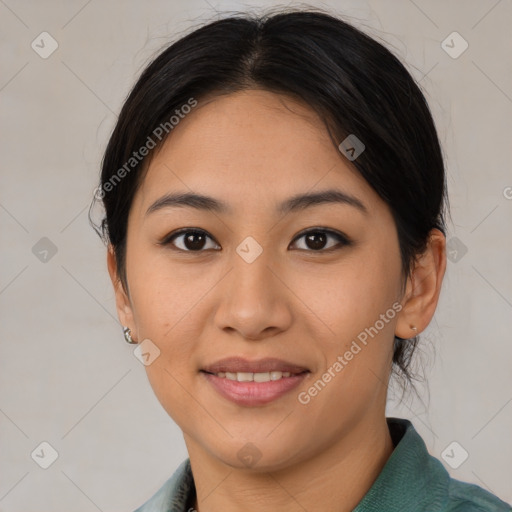 Joyful asian young-adult female with medium  brown hair and brown eyes