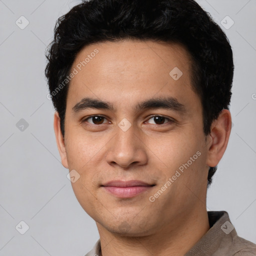 Joyful white young-adult male with short  black hair and brown eyes
