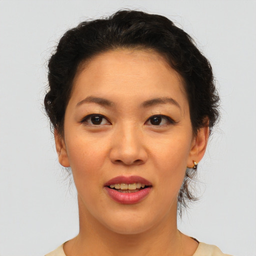 Joyful asian young-adult female with short  brown hair and brown eyes