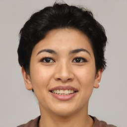 Joyful asian young-adult female with short  black hair and brown eyes