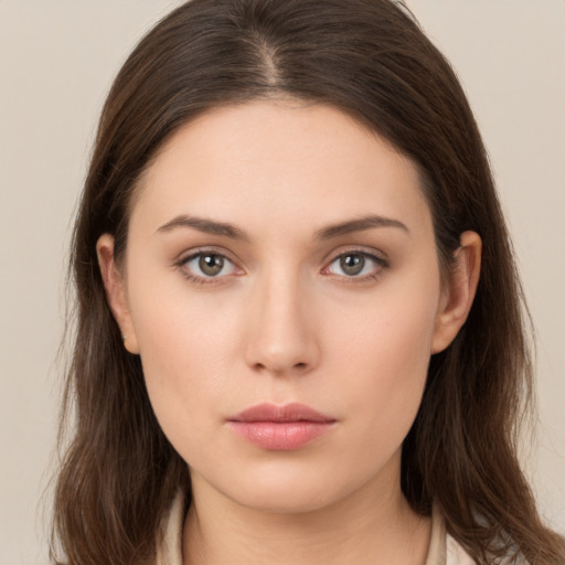 Neutral white young-adult female with long  brown hair and brown eyes