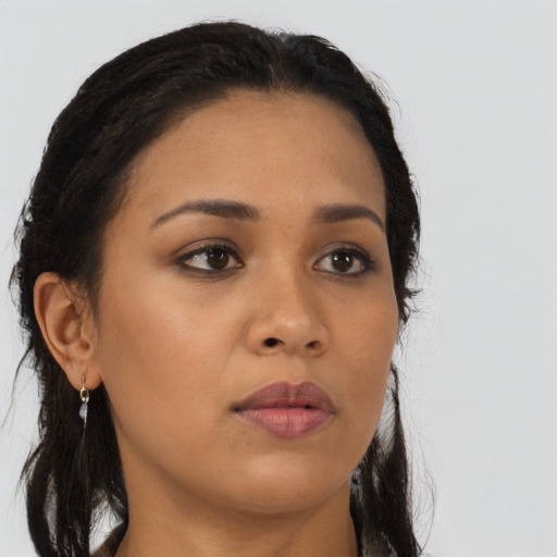 Neutral black young-adult female with long  brown hair and brown eyes