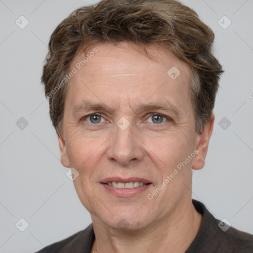 Joyful white adult male with short  brown hair and grey eyes