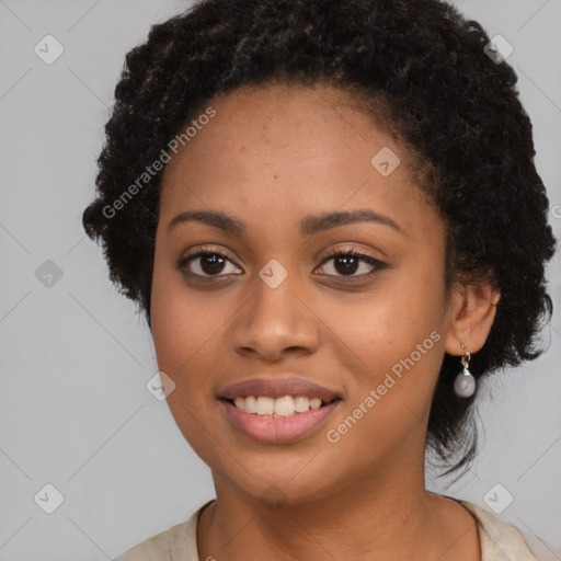 Joyful black young-adult female with long  black hair and brown eyes