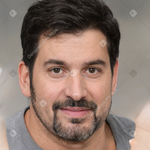 Joyful white adult male with short  black hair and brown eyes